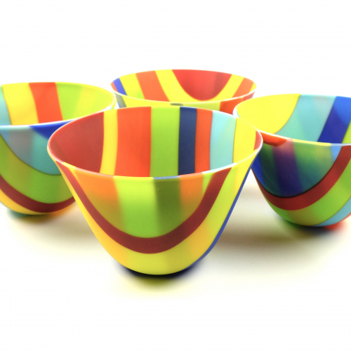 a collection of striped glass bowls